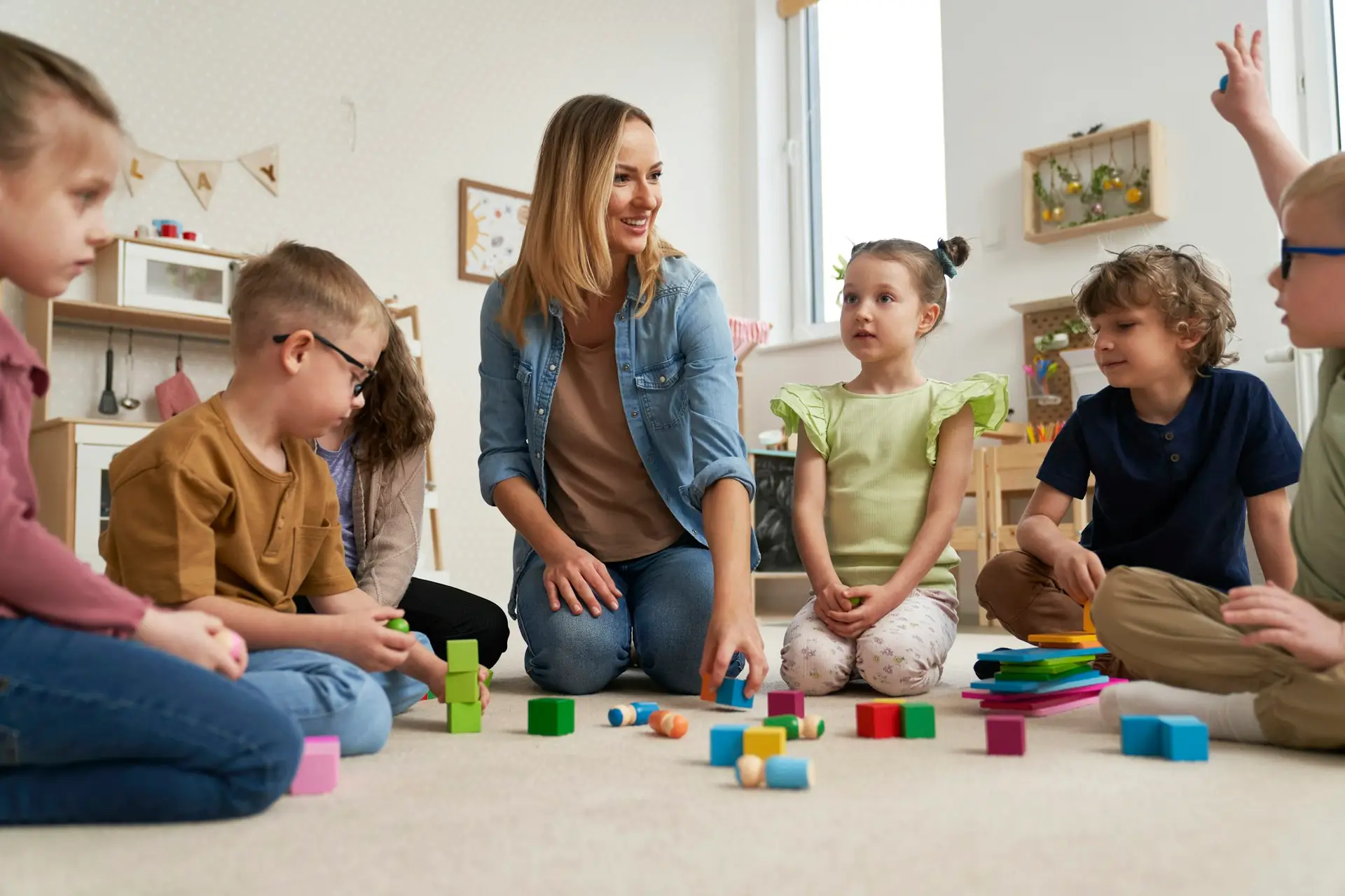 Teacher performs exercises to the children